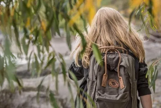 Girl with backpack bug out