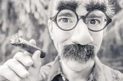 Disguised Man Holding Cigar